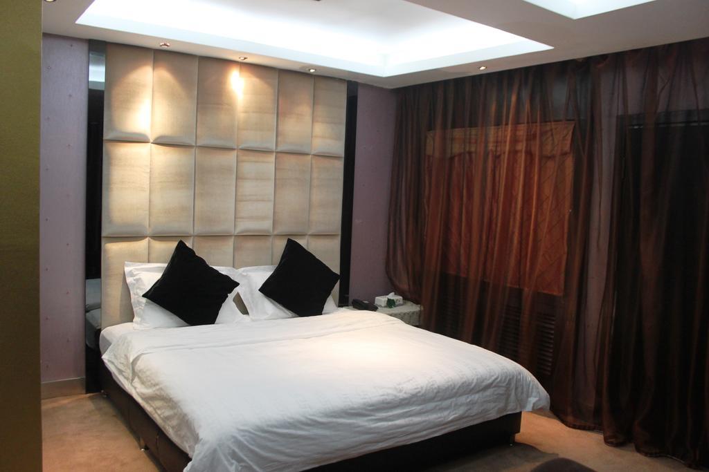 Harbin Yakelai Holiday Hotel Номер фото